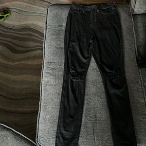 Black knee ripped skinny jeans being sold.